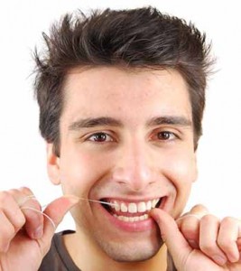 Pembroke Pines dentists - smiling man flossing